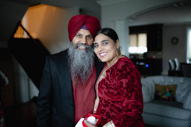 istock An Indian man offering a gift to his wife 1012702380
