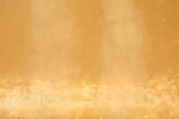 istock Yellow old faded wall texture background 1012719320