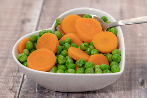 Bowl of peas and carrots