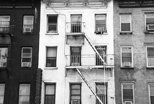 Black white and grey tenement buildings in New York City