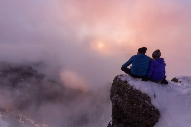 istock Friends on top of a mountain peak 1012728218