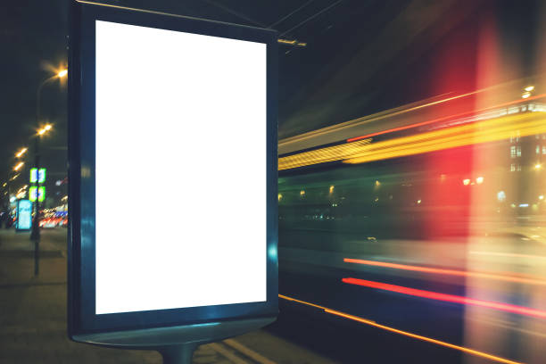 istock Blank lightbox at night with car lights in motion blur 1012737788