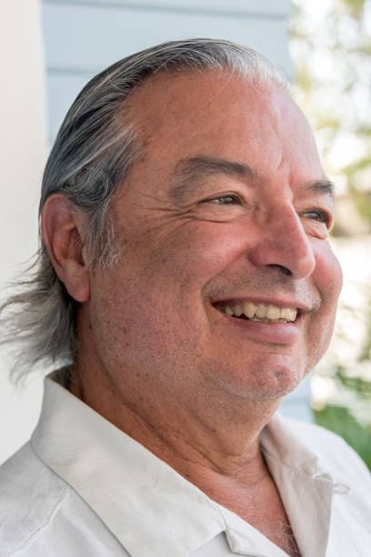 istock Smiling senior man with long white hair 1012738156
