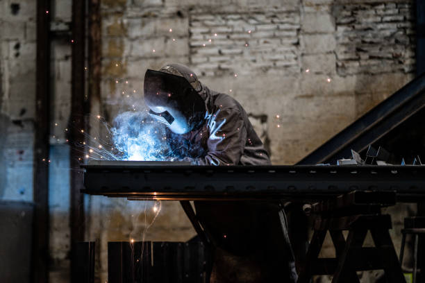 istock Industrial Worker welding steel 1012738240