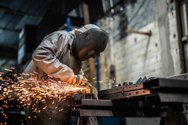 Industrial Worker welding steel Business and Industry grinding metal power work tool stock pictures, royalty-free photos & images