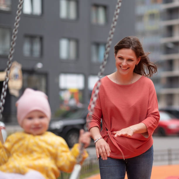 istock Baby boy having fun on a swing. 1012753986