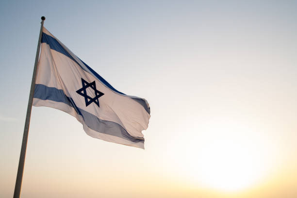 Israel Flag A Flag of Israel on Masada israeli flag photos stock pictures, royalty-free photos & images