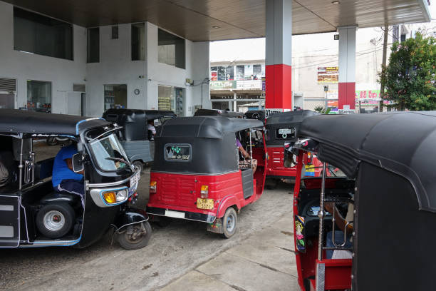 Many tuk-tuk taxi in line at the gas station in Panadura city Panadura, Sri Lanka - May 10, 2018: Many tuk-tuk taxi in line at the gas station in Panadura city taxi sri lanka stock pictures, royalty-free photos & images