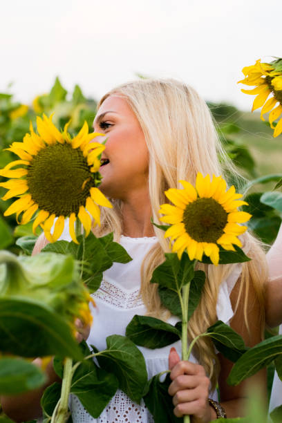 istock Beautiful Girl At Sunflowers Fields 1012776112