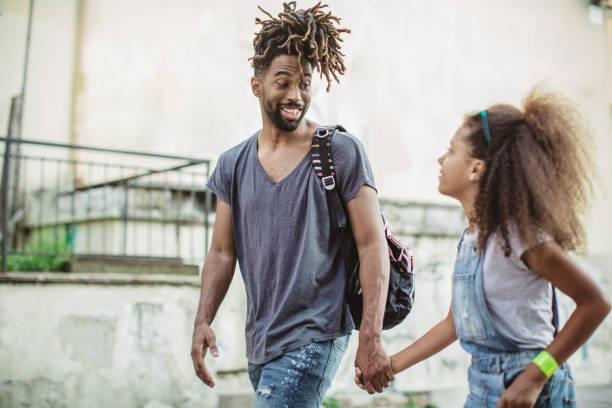 istock Father taking daughter to school 1012778628