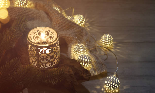 istock Cosy and soft winter background, knitted sweater and lights 1012778978