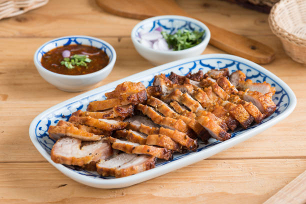 istock Deep Fried Crispy Pork Belly Cooked with Garlic and spicy dipping sauce 1012801648
