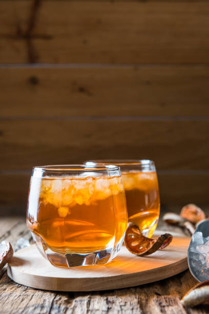istock Bael juice ice tea on wooden table , healthy drink 1012801874