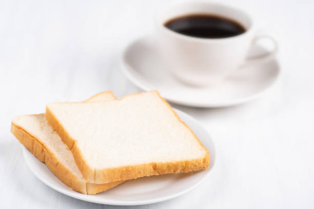 istock Sliced bread and cup of black coffee 1012816200