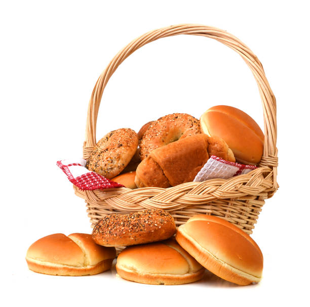 istock Composition with bread and rolls in wicker basket isolated on white 1012825858