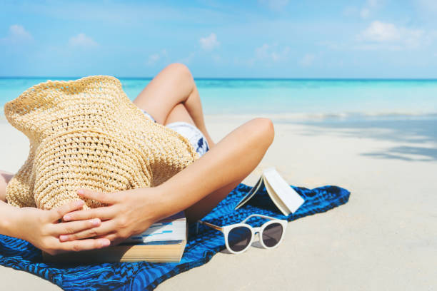 istock Asian women relaxing in summer holiday on beach 1012835836