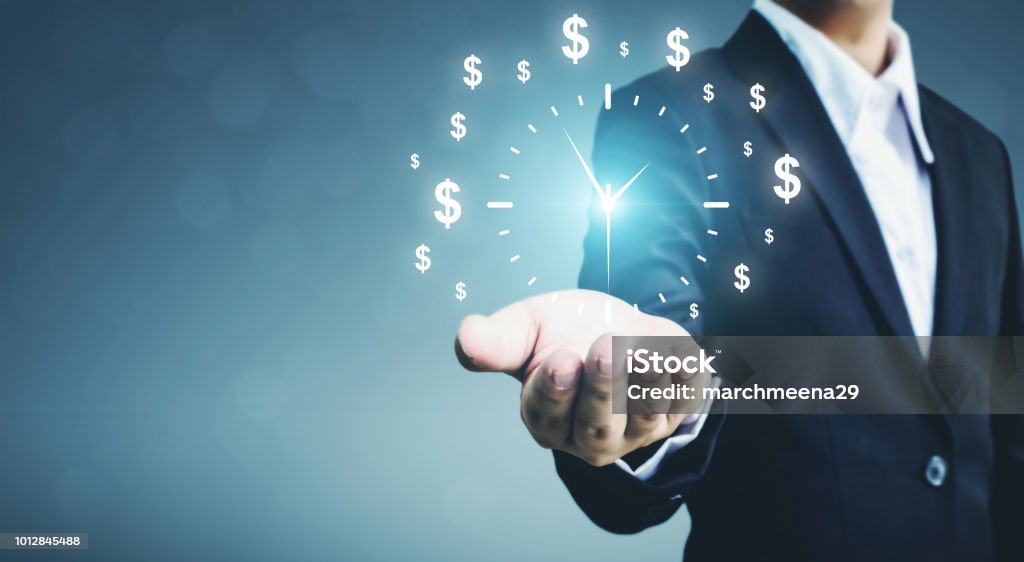 Businessman holding sign clock. Concept business time is money Time Stock Photo