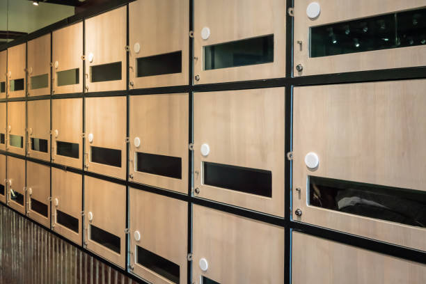 istock Wall of wooden postal mailboxes and lockers Communication throwback concept. Empty post box row for background. 1012845658