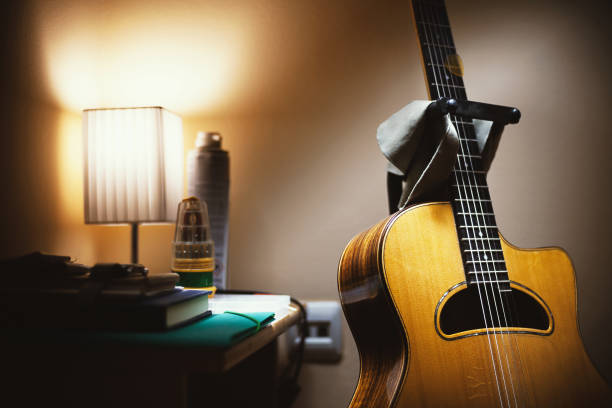 istock Acoustic Guitar in Room 1012850554