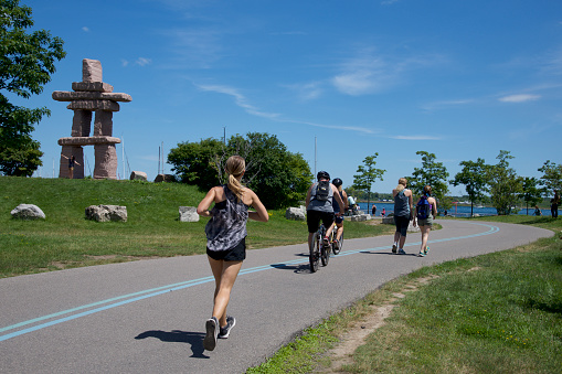Where: The Toronto Inukshuk Park, Toronto, Ontario, Canada \nWhen : July 3, 2017\nWhat  : People enjoy the holiday weekend with riding bicycle, walking and running.