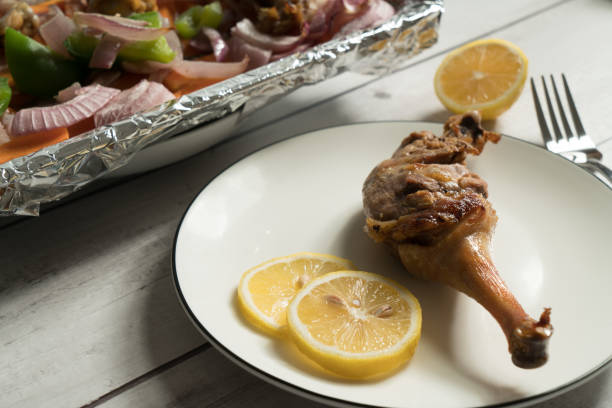 istock Roast duck leg on the wooden table 1012860190