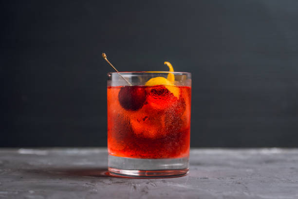 istock Old fashioned cocktail with cherry and orange peel 1012867674