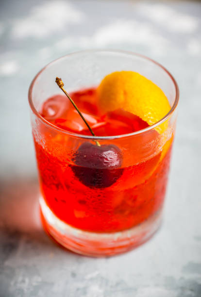 istock Old fashioned cocktail with cherry and orange peel 1012867764