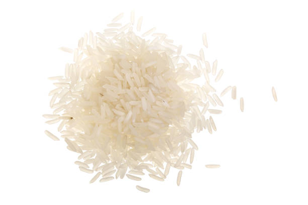 istock rice grains isolated on white background. Top view. Flat lay 1012895048