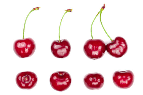 istock Sweet red cherries isolated on white background. Top view. Flat lay pattern 1012895108