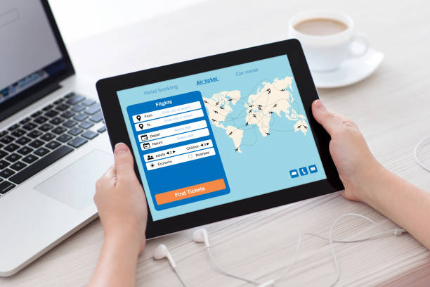 istock female hands holding tablet with application search air ticket screen 1012900548