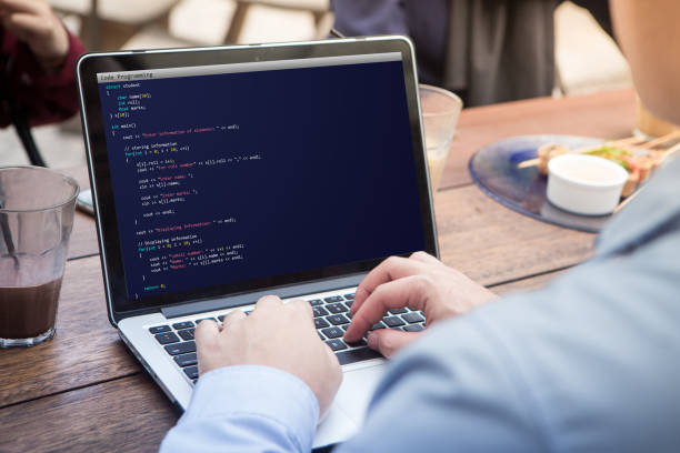 Man coding and programming for web development and web design concept using laptop / computer. Coding concept. Programming concept. stock photo