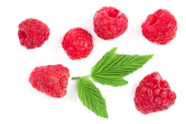 istock raspberries with leaves isolated on white background. Top view. Flat lay pattern 1012930846