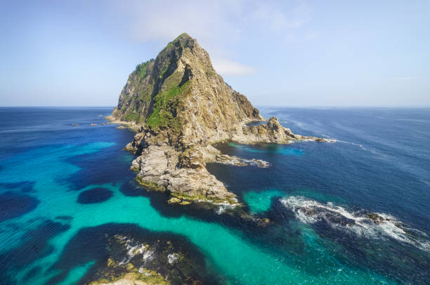 Rocky seashore on a sunny day. Sakhalin Island, Russia.