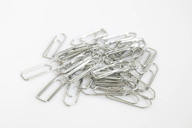 istock Stationery, colored clasps isolated in a white background composition 1012964160