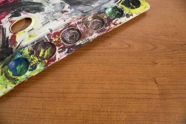 istock A palette full of old paint on a wood table composition 1012964196