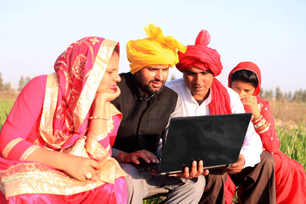 istock Two farmer sitting portrait with their wife 1012986246