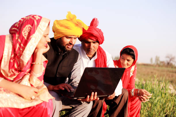 istock Two farmer sitting portrait with their wife 1012988046