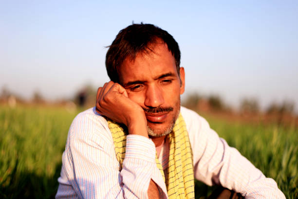 istock Thoughtful farmer portrait outdoor 1012988302