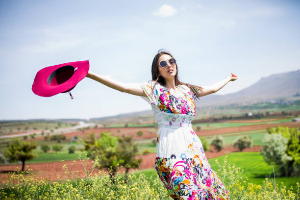 istock a young woman in the spring 1012988970