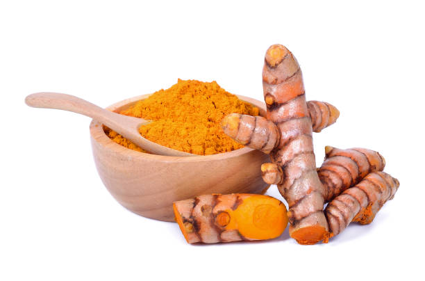 istock Turmeric roots and powder isolated on white background 1013002610