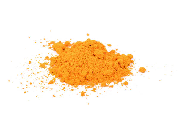 istock Turmeric (Curcuma longa Linn) powder pile isolated on white background 1013002636