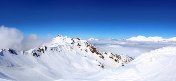 view over misty mountains from mount titlis, engelberg, switzerland. 3200m above sea level.