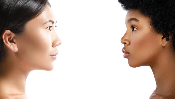 istock Asian and African woman on white background 1013009968
