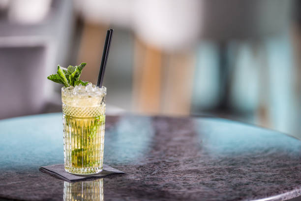istock Mojito summer alcoholic cocktail on table in restaurant. 1013013258