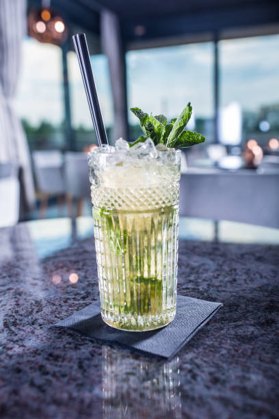 istock Mojito summer alcoholic cocktail on table in restaurant. 1013013260