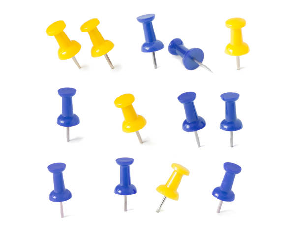 istock isolated blue and yellow push pins in white background 1013019538
