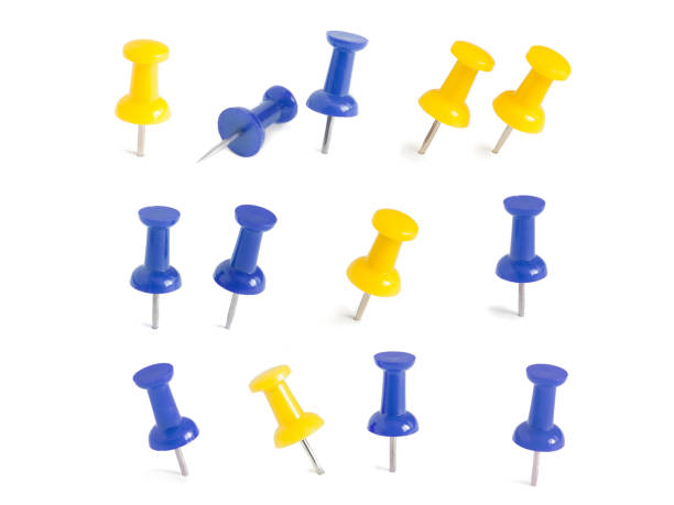istock isolated blue and yellow push pins in white background 1013019554