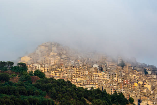 This fog enveloping Gangi was formed after a summer storm. Gangi is a typical village within the Northern Sicily