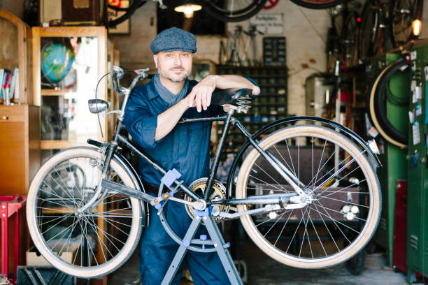 istock Portrait: hobby mechanic in overall in his bicycle workshop 1013043114