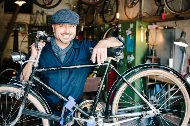 istock Portrait: hobby mechanic in overall in his bicycle workshop 1013043204